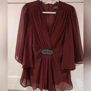 Fancy blouse with sheer sleeves and glittery beaded accent.